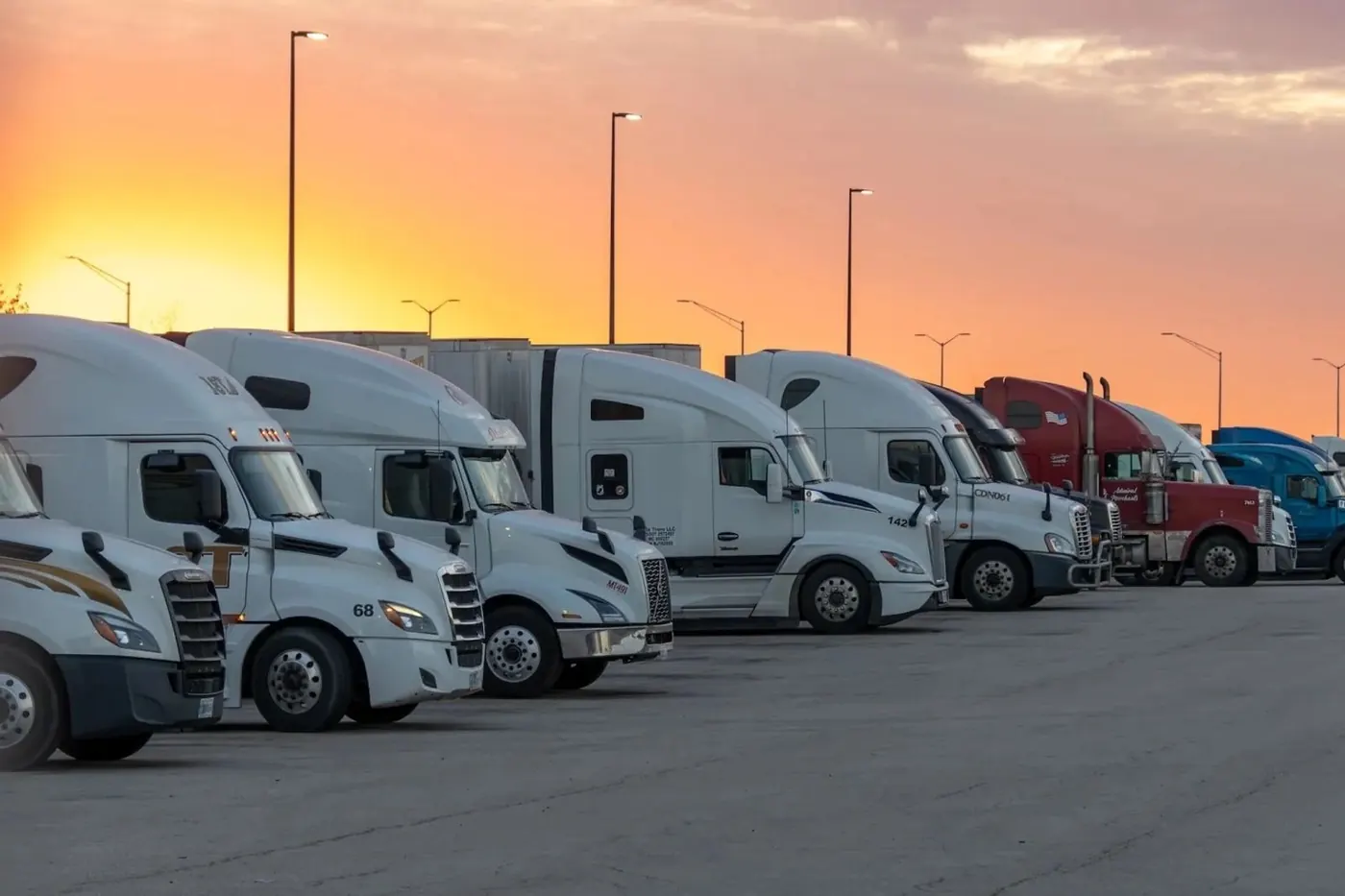 Line of semis using Tulsa truck parking at sunset
